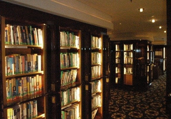 The Library is one of seven secret hideaways aboard Queen Mary 2 Cunard Queen Mary 2 library bookcases.