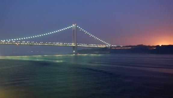 Cunard Queen Mary 2 nearing Verrazano Bridge in NYC at dawn. Cunard Queen Mary 2 nearing Verrazano Bridge in NYC at dawn.