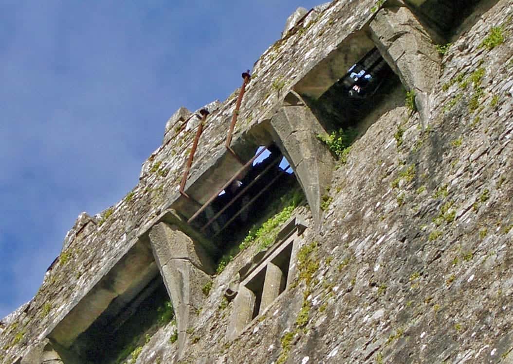 Tourist kissing the Blarney Stone in Ireland.