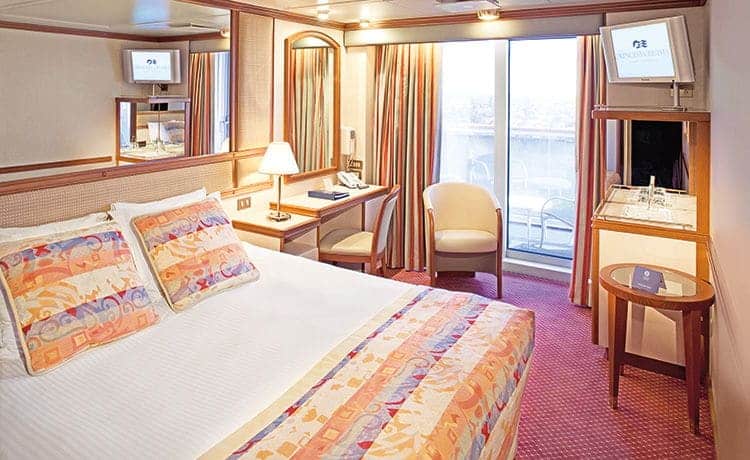 The standard balcony stateroom includes a mini-bar and comfortable seating on the balcony.