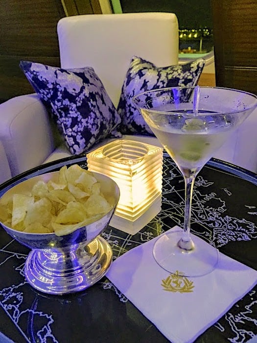 Queen Mary2 Commodore Club and a Martini and chips.