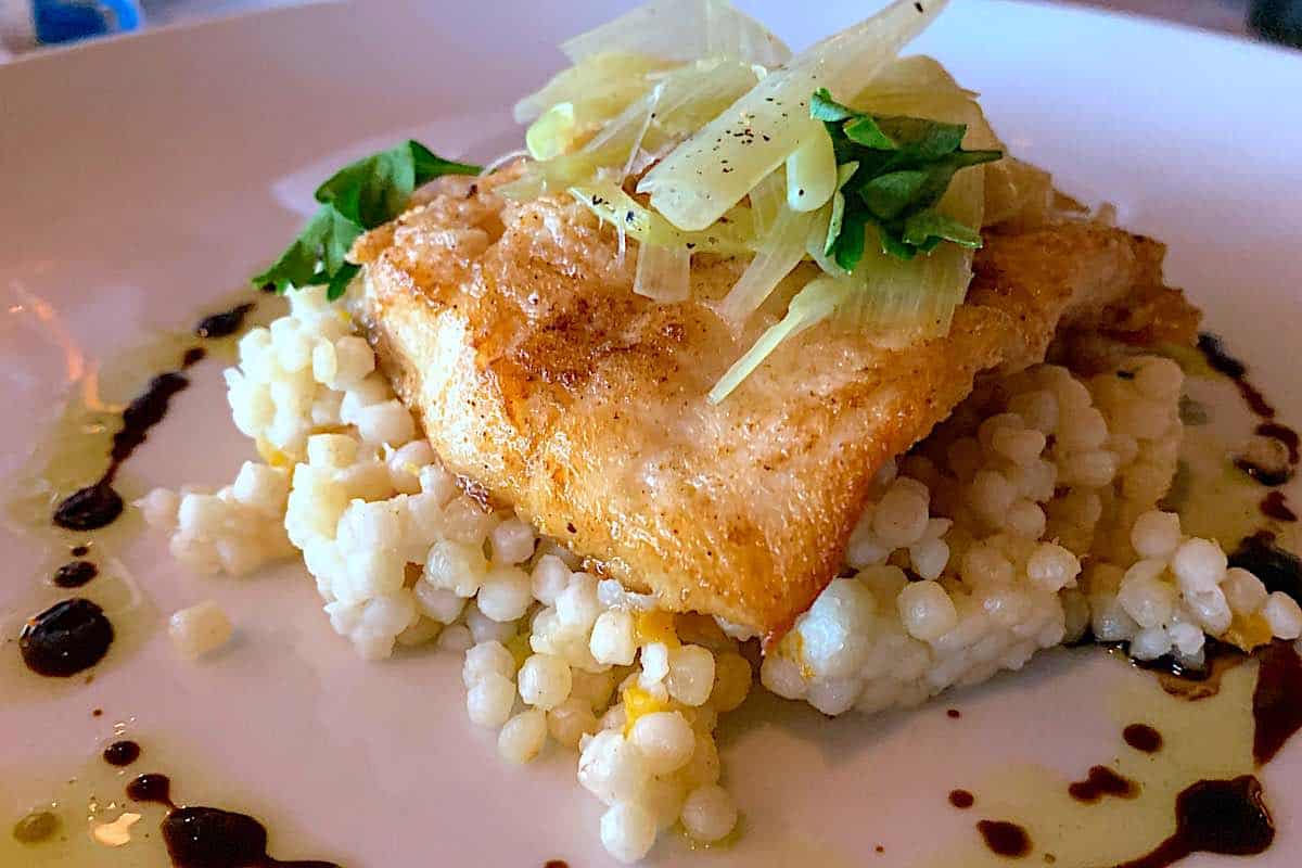 sauteed halibut with leeks and onions on a bed of lemon couscous.
