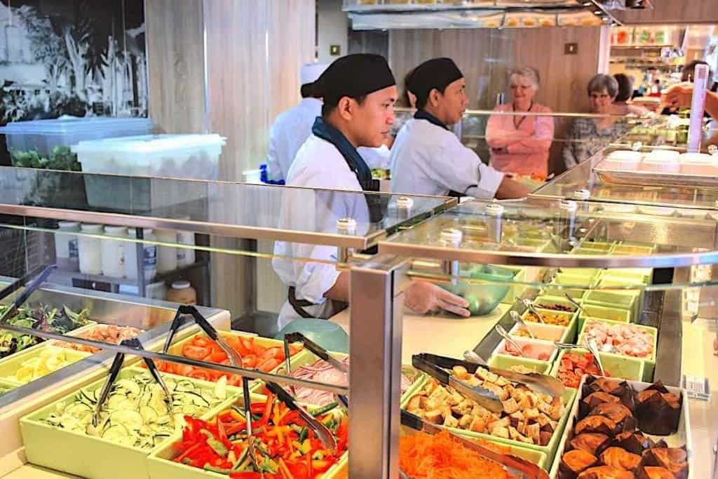 Buffet lunch and crew serviing the food options.