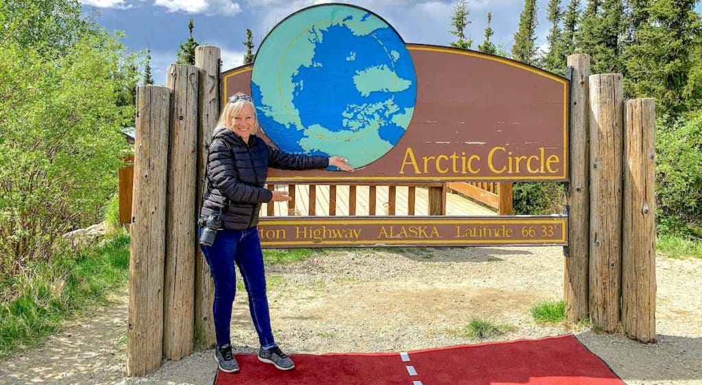 On a solo cruise to Alaska, I took a shore tour to this welcome to the Arctic Circle sign.