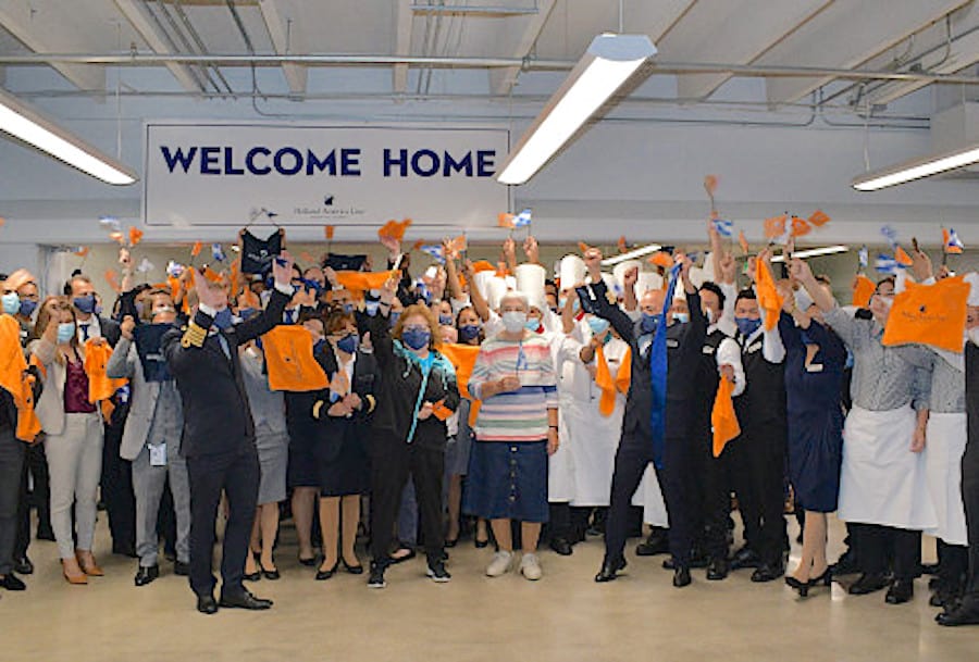 Crew greets passengers as first Nieuw Statendam cruises begin.