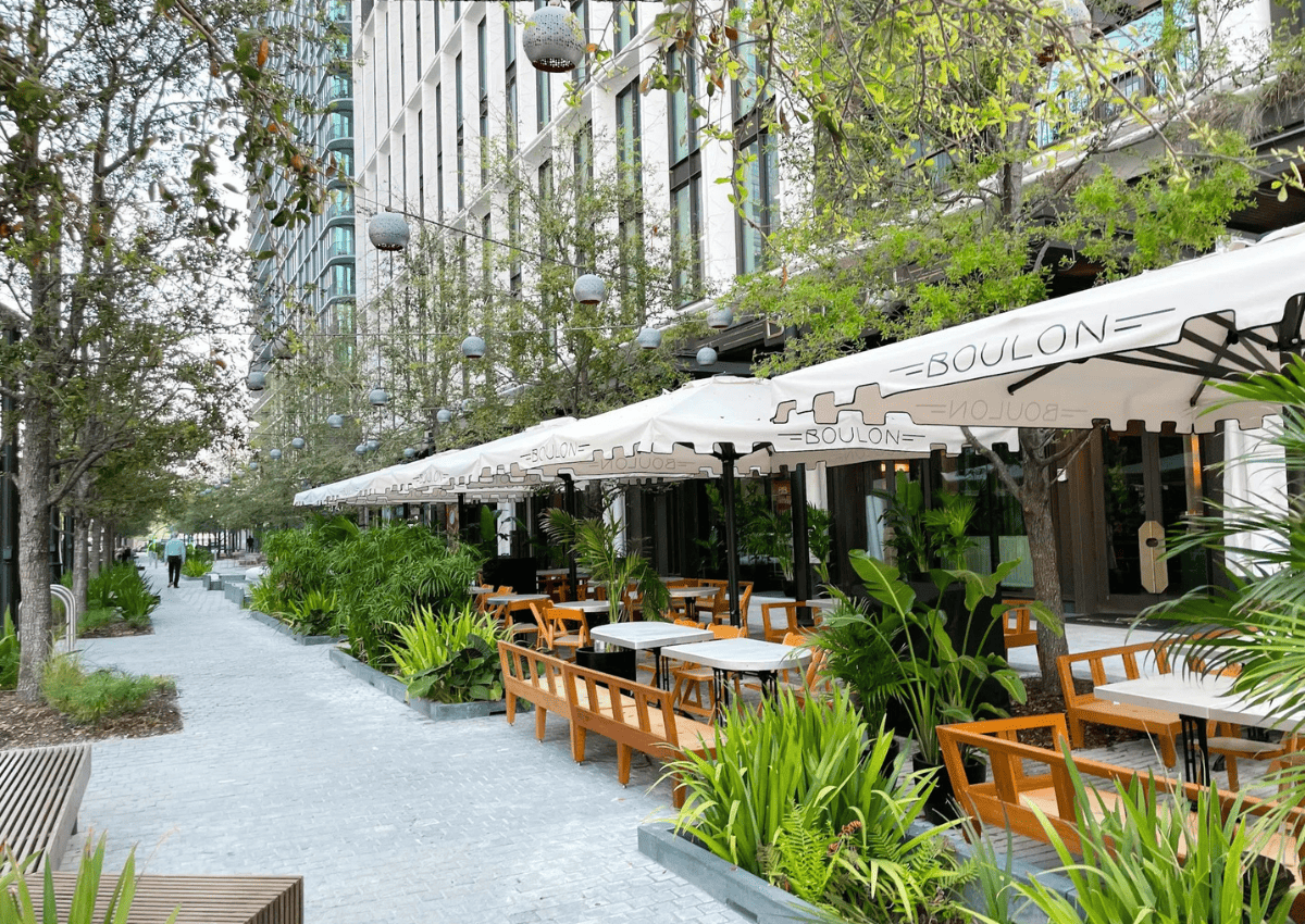 Standing on the sidewalk of Water Street Tampa looking towards a dining patio for a restaurant. Standing on the sidewalk of Water Street Tampa looking towards a dining patio for a restaurant.