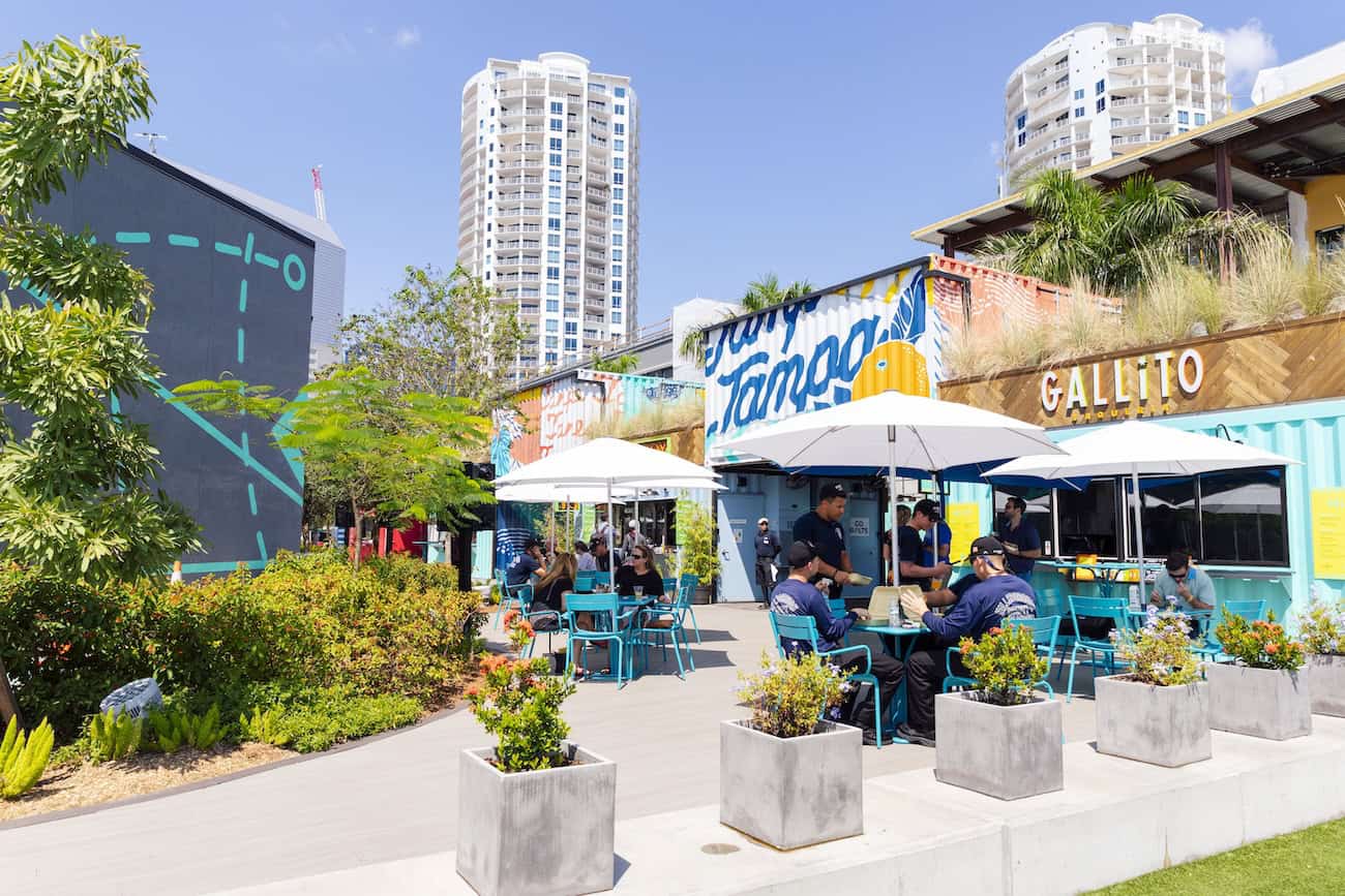 Sparkman Wharf restaurants with umbrella tables.
