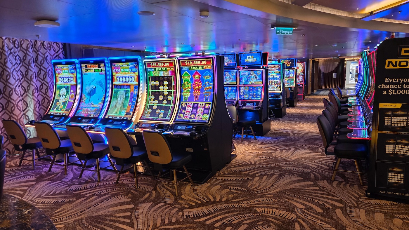 Holland America Rotterdam with rows of colorful slot machines and updated seating.